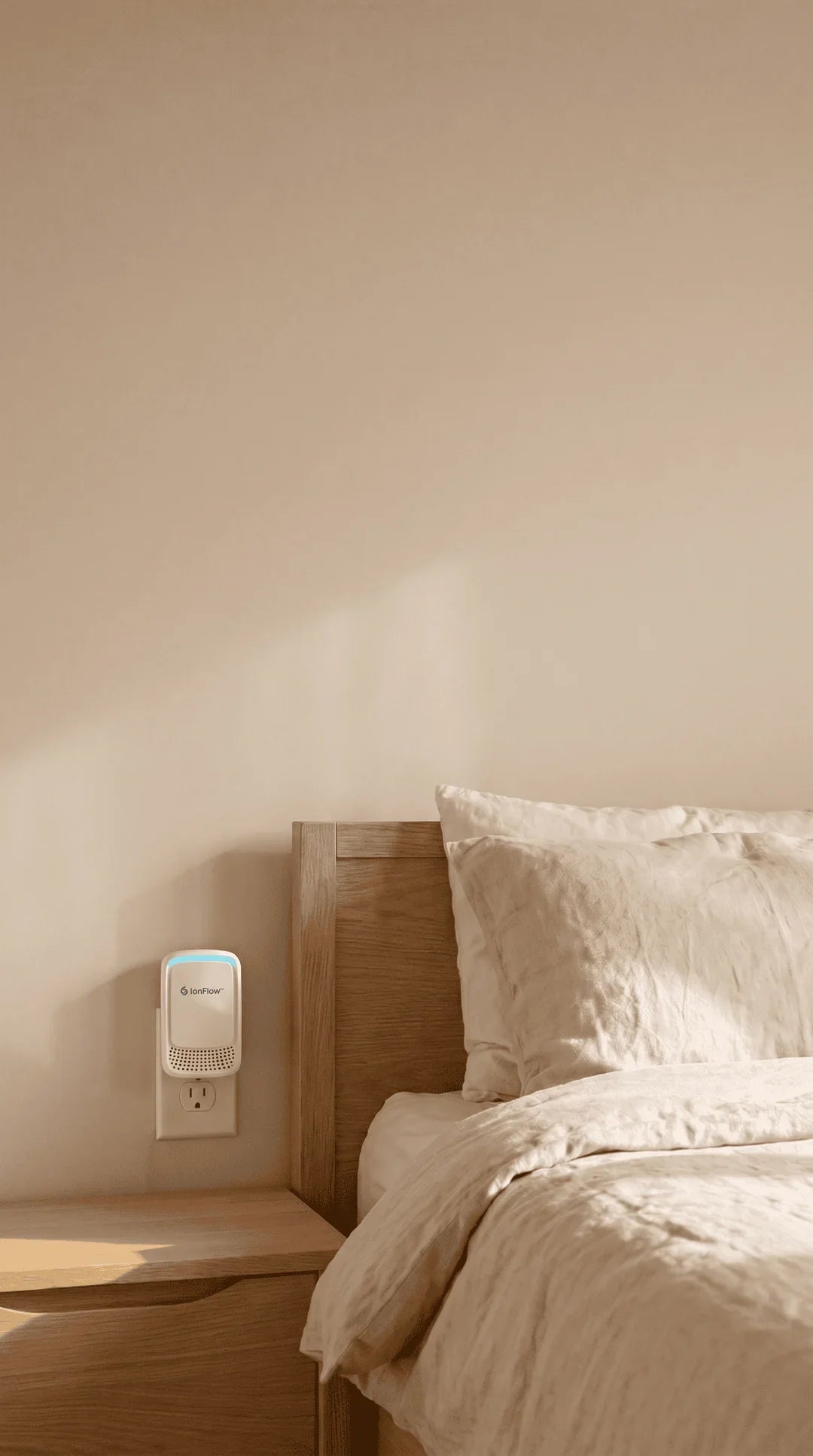 IonFlow beside a bed in a calm, bright bedroom